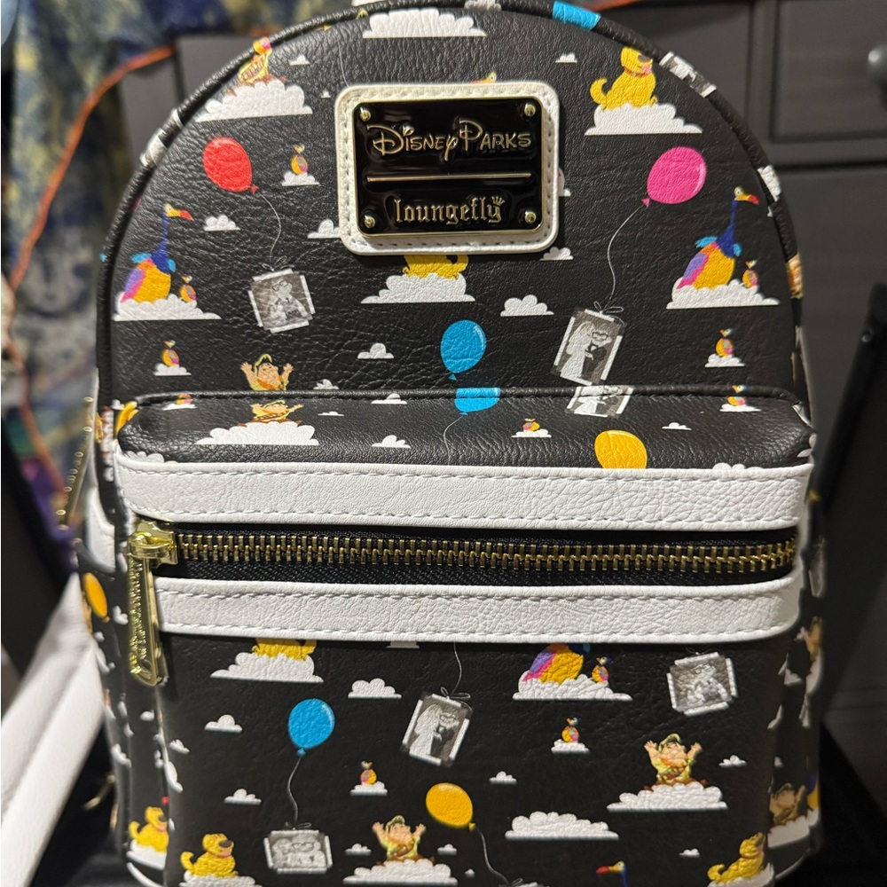 Loungefly hard tag Up movie with all over character print outside/ interior!